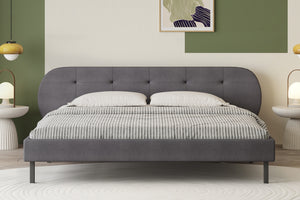 Letto capitonné 140x190 cm grigio con testiera e rete Tulsa foto d’ambiente